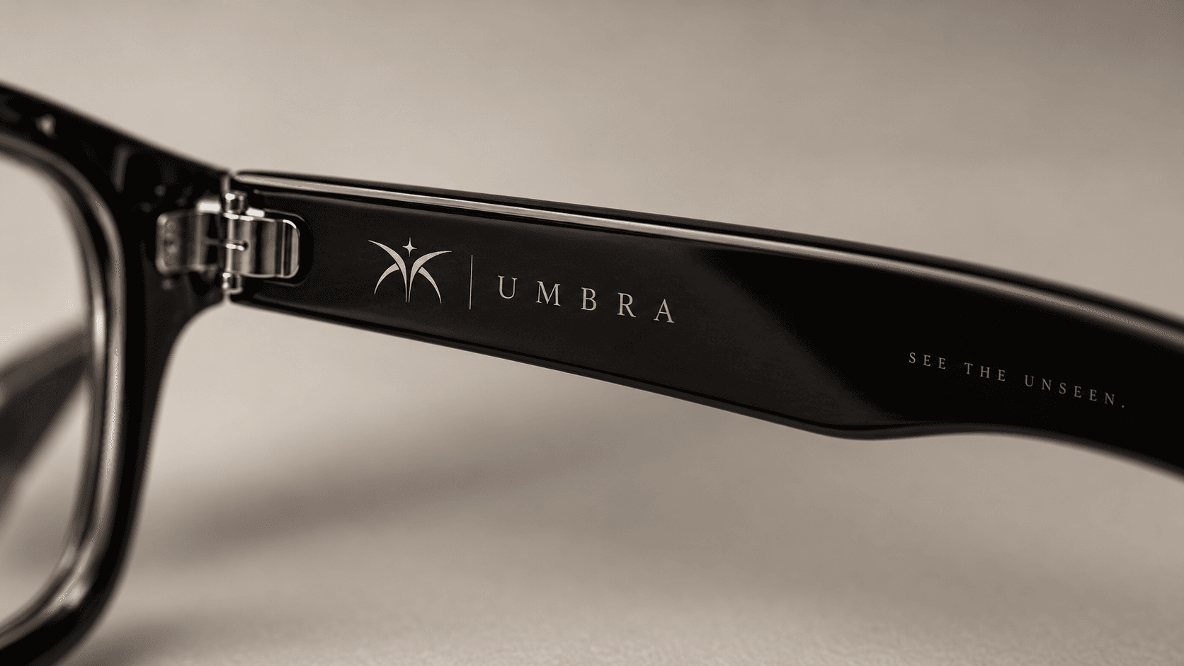 Concept render of the inner-arm engraving showing the emblem and UMBRA lettering